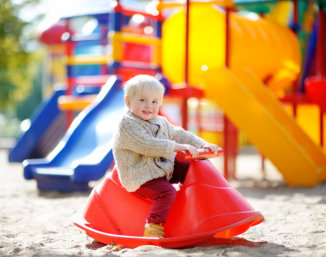 toddler playing at the playground